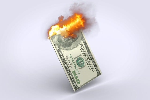 US currency on fire